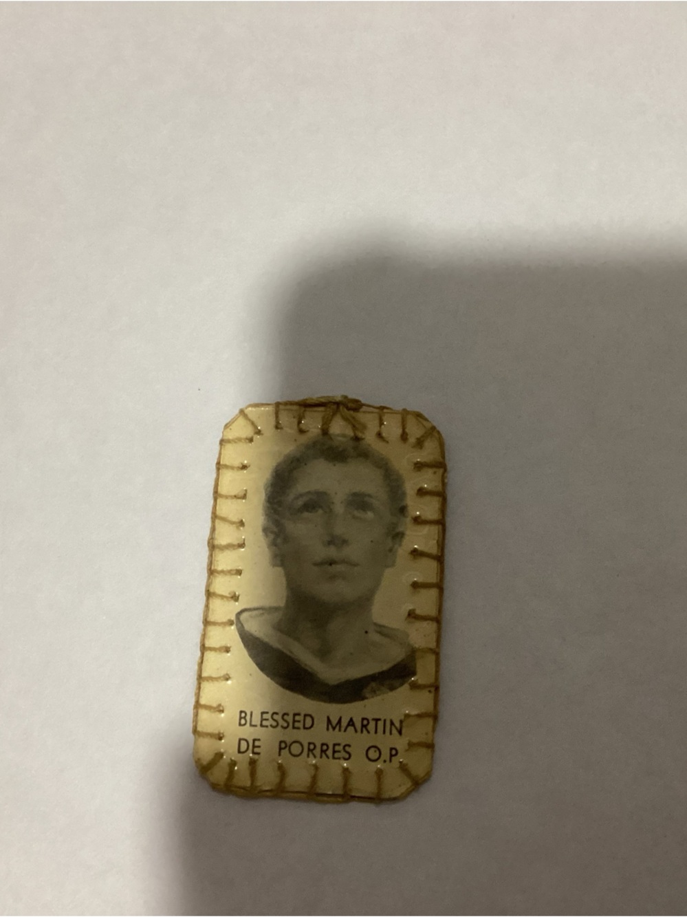 Vintage Catholic Third-Class Relic Badge, a piece of linen